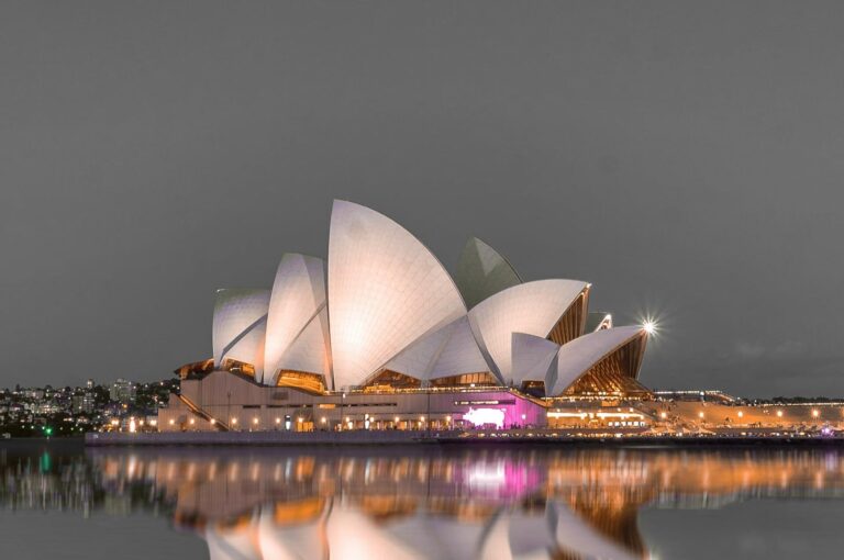 Stunning night view of the Sydney Opera House and city skyline in Australia.