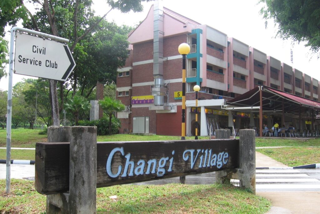 This collection of images showcases The Bus Collective, a unique hotel in Singapore's Changi Village where decommissioned public buses have been transformed into luxury guest suites. Each unit features a creatively themed exterior, such as floral or tropical patterns, and a modern, high-end interior equipped with amenities like plush seating, air conditioning, and flat-screen TVs.