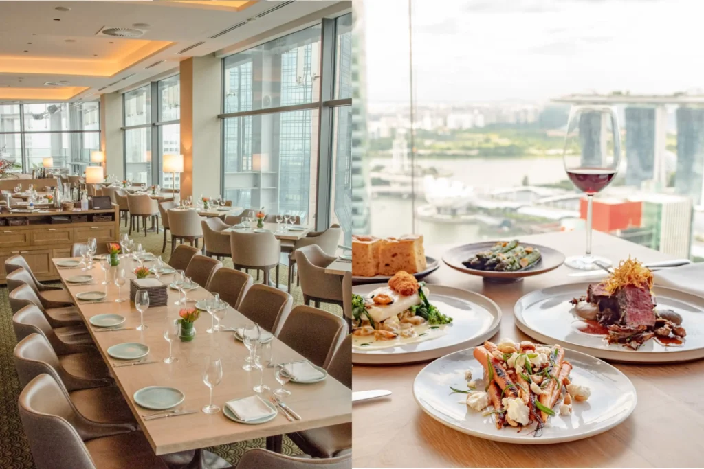 The left side of the image shows a spacious, upscale restaurant dining room with large floor-to-ceiling windows overlooking a city, featuring a long set table in the foreground. The right side displays a close-up of a table laden with gourmet dishes, including steak, roasted carrots, and a glass of red wine, with a scenic view of Marina Bay Sands in Singapore visible through the window.